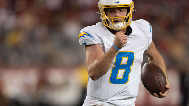 Aug 25, 2023; Santa Clara, California, USA; Los Angeles Chargers quarterback Max Duggan (8) runs with the football during the fourth quarter against the San Francisco 49ers at Levi's Stadium. Mandatory Credit: Stan Szeto-USA TODAY Sports 
